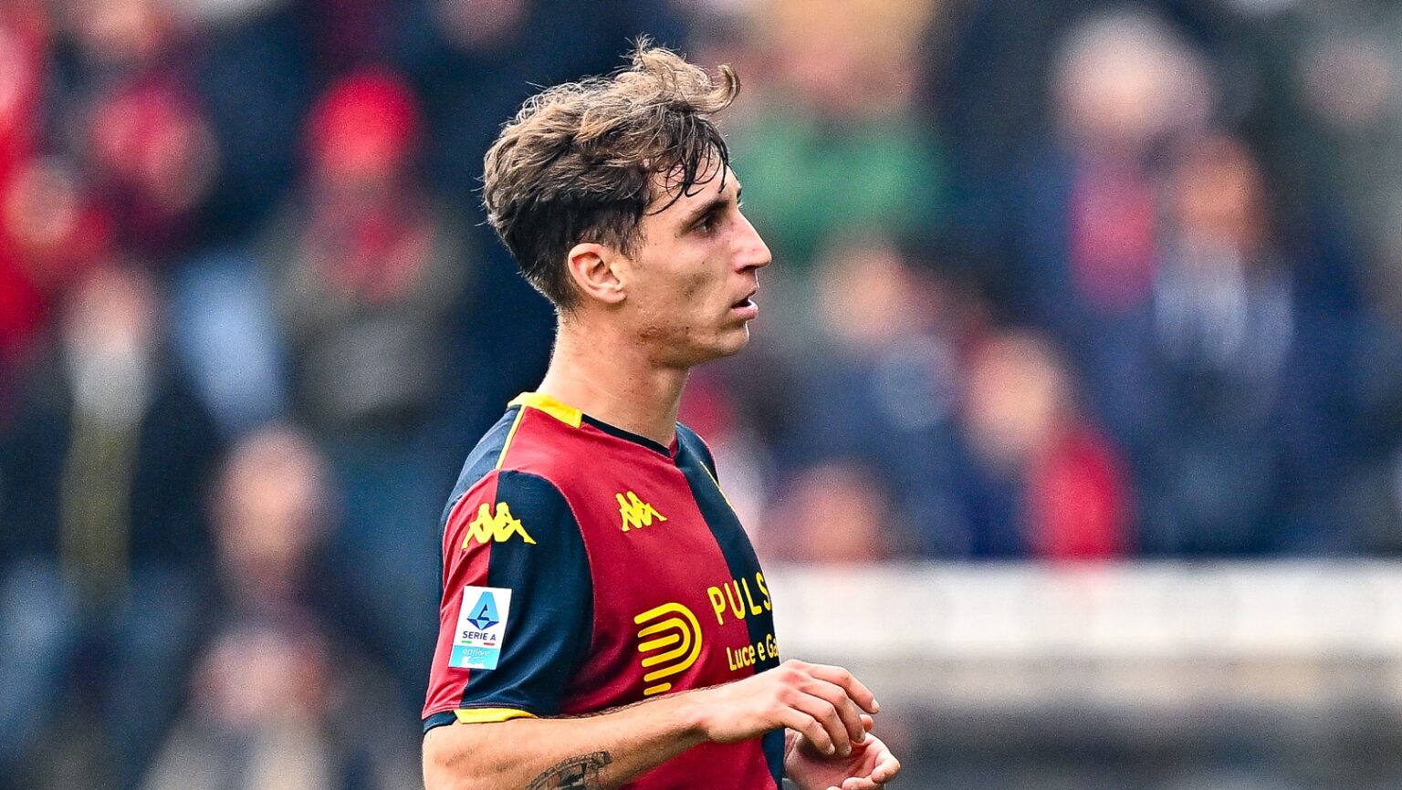 Tommaso Baldanzi in Genoa home kit during a Serie A match